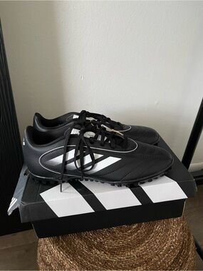 Adidas women’s Black Turf Soccer Shoes with White Stripes